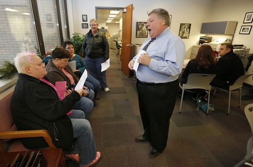 Utah County Clerk and Auditor Bryan Thompson hands out rejection letters for a marriage license to Raylynn Marvel left, Patsy Carter, 2nd left, from Orem, Utah, Loreen Major 2nd right, and Arlene Arnold right, from Lehi, Utah in the offices of the Utah County Clerk and Auditor office on Dec. 20, 2013 in Provo, Utah. A Federal Judge on Friday struck down Utah's ban on same sex marriage saying the law violates the U.S. Constitution.  (Photo by George Frey  |  Special to the Tribune)