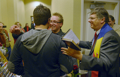 Steve Griffin  |  The Salt Lake Tribune


Rev. Gage Church, of the Congregational United Church of Christ, marries Wayne Elwood and Trever Olsen, of Layton, at the Hampton Inn Suites in Ogden, Utah Monday, December 23, 2013. Church, who volunteered his services, married his husband Tim Sharp, just minutes before. Couples were being married at the hotel across the street from the Weber County Clerk's office, where received their marriage licenses.