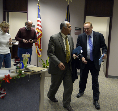 Keith Johnson | The Salt Lake Tribune

Utah Sen. Jim Dabakis (right) and Salt Lake County District Attorney Sim Gill leave the Salt Lake County clerks office Friday, December 20, 2013. Sen. Dabakis  was trying to keep the clerks office open late Friday to accommodate same sex couples seeking marriage licenses. Dabakis married his parnter earlier that afternoon at the county office. A federal judge in Utah Friday struck down the state's ban on same-sex marriage, saying the law violates the U.S. Constitution's guarantees of equal protection and due process.