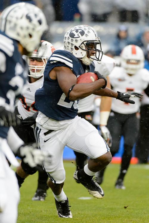 Trent Nelson  |  The Salt Lake Tribune
Brigham Young Cougars running back Adam Hine (28) runs the ball as BYU hosts Idaho State, college football at LaVell Edwards Stadium in Provo, Saturday November 16, 2013.