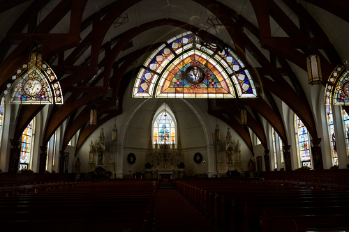 Scott Sommerdorf   |  The Salt Lake Tribune
A view of the sanctuary with stained glass near the front entry reflected in the glass doors to the sanctuary at St. Joseph's parish in Ogden, Wednesday December 18, 2013.