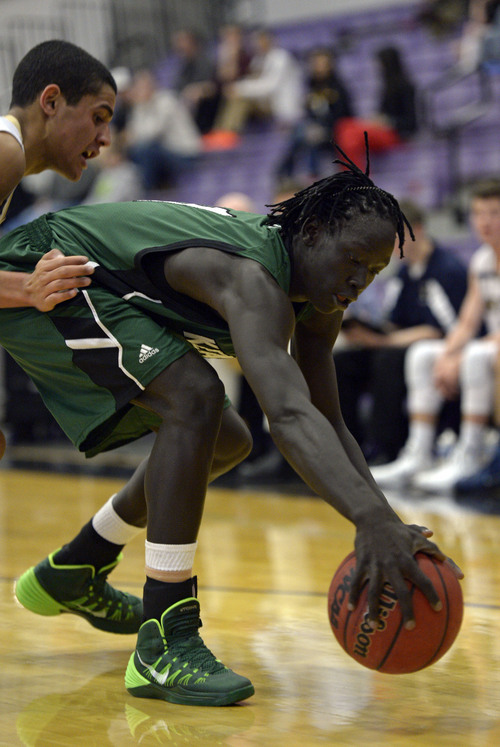 Francisco Kjolseth  |  The Salt Lake Tribune
Bushmen Ebet of Kearns reaches out for a ball against Skyline in the Riverton Holiday Tourney at Riverton High school on Friday, Dec. 27, 2013.