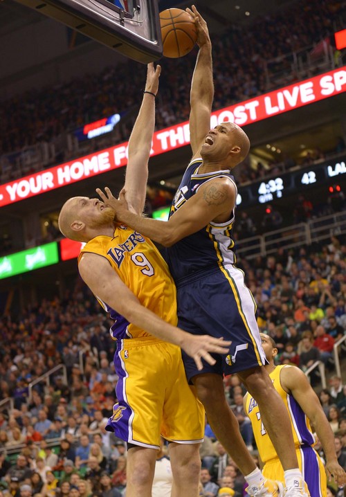 Leah Hogsten  |  The Salt Lake Tribune
Utah Jazz small forward Richard Jefferson (24) drives to the net over Los Angeles Lakers center Chris Kaman (9). The Utah Jazz defeated the LA Lakers 105-103, Friday, December 27, 2013 at Energy Solutions Arena in Salt Lake City.