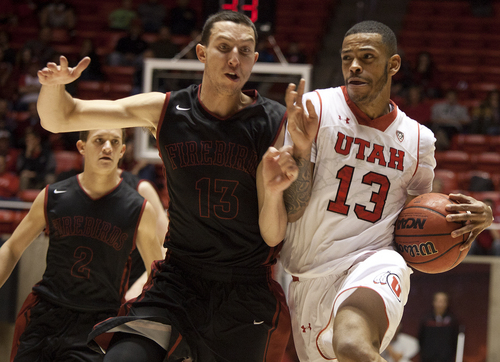 JIM MCAULEY | The Salt Lake Tribune
Utah's Ahmad Fields goes head to head with St. Katherine's Alex Perez during a game at the University of Utah's Huntsman Center on December 28, 2013.