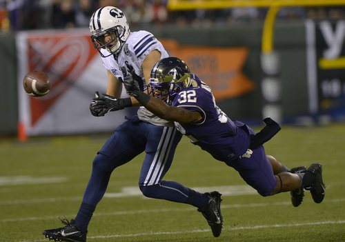 Scott Sommerdorf   |  The Salt Lake Tribune
Washington Huskies DB Tre Watson (32) leaps to break up a pass intended for Brigham Young Cougars WR Skyler Ridley (17) that stalled BYU's first drive at the Fight Hunger Bowl at AT&T Park in San Francisco, Friday December 27, 2013.