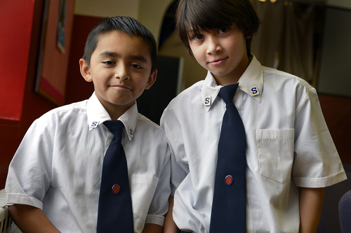 Scott Sommerdorf   |  The Salt Lake Tribune
Youth Soldiers Victor Marcial, 8, and Dominicc Carrillo, (cq), 9, pose at the Salt Lake Congregation of the Salvation Army, Sunday December 22, 2013. The congregation is meeting in an old Mormon wardhouse, reconfigured for the Army's use