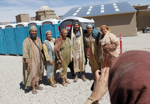 Al Hartmann  |  The Salt Lake Tribune
Actors in the staging area just of  the "Old Jerusalem" movie set near Elberta, Utah have a parting group picture taken Wednesday May 22.    The Church of Jesus Christ of Latter-day Saints is in the last few days of filming for the New Testament video library project (Bible Videos).