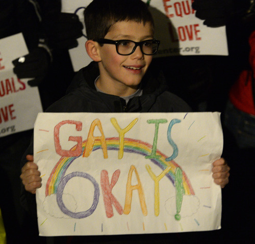 Rick Egan  | The Salt Lake Tribune 

Nine-year-old Tarek Rojas, Sandy, holds a sign at the "Celebrate Marriage Equality Rally" at Washington Square,Monday, December 23, 2013.