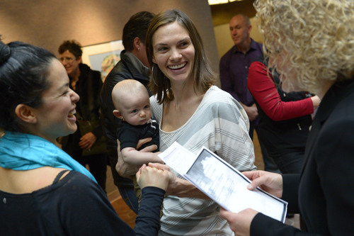 Francisco Kjolseth  |  The Salt Lake Tribune
Danielle Torres, left, and partner of 7-years, Jody Jones holding their son Franti Torres-Jones, 3-months, are overjoyed with hearing the word Utah as they are married in the lobby of the Salt Lake County offices on Monday, Dec. 23, 2013. Hundreds of same-sex couples descended on county clerk offices to request marriage licenses. A federal judge in Utah struck down the state's ban on same-sex marriage last Friday, saying the law violates the U.S. Constitution's guarantees of equal protection and due process.