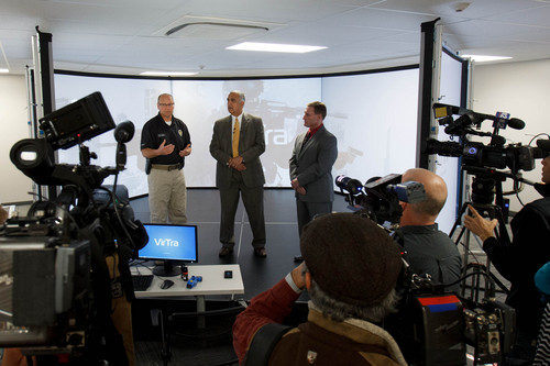 Trent Nelson  |  The Salt Lake Tribune
Unified Police Deputy Chief Shane Hudson, District Attorney Sim Gill, and Salt Lake County Councilman Steve DeBry give details on a new five-screen training simulator used to put officers through realistic situations in Salt Lake City, Thursday November 7, 2013.