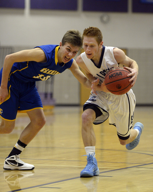 Francisco Kjolseth  |  The Salt Lake Tribune
Connor Ivins of Taylorsville puts on the pressure as Layton's Alex Price takes off in the Riverton Holiday Tourney at Riverton High school on Friday, Dec. 27, 2013.