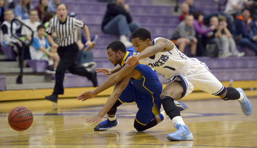 Francisco Kjolseth  |  The Salt Lake Tribune
Layton's Julian Blackmon, front, battles Sidney Freeman of Taylorsville for posession of a ball during game action in the Riverton Holiday Tourney at Riverton High school on Friday, Dec. 27, 2013.