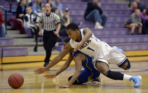Francisco Kjolseth  |  The Salt Lake Tribune
Layton's Julian Blackmon, front, battles Sidney Freeman of Taylorsville for posession of a ball during game action in the Riverton Holiday Tourney at Riverton High school on Friday, Dec. 27, 2013.