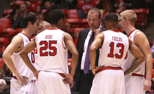 Leah Hogsten  |  The Salt Lake Tribune
Utah Utes head coach Larry Krystkowiak    directs his charges in the second half. University of Utah defeated Evergreen State 128-44 Friday, November 8, 2013 at the Huntsman Center.