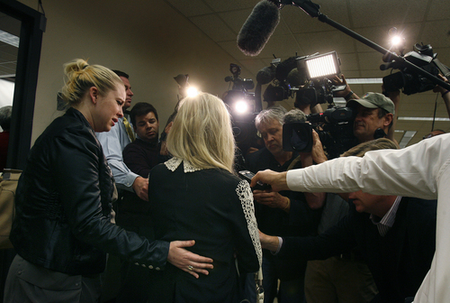 Scott Sommerdorf   |  The Salt Lake Tribune
Linda Cluff, Michelle McNeill's sister, right, is supported by her daughter,  Jill Harper-Smith, left, as she is interviewed following the reading of the guilty verdict against Martin McNeill. McNeill was found guilty of the murder of Michelle McNeill and obstruction of justice early Saturday morning, November 9, 2013.