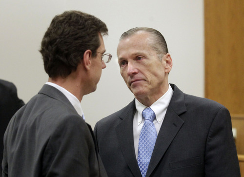 Al Hartmann  |  The Salt Lake Tribune
Defense lawyer Randy Spencer left, talks to is client Martin MacNeill at the conclusion of his three week murder trial in Provo, Utah 4th District Court Friday November 8, 2013.
