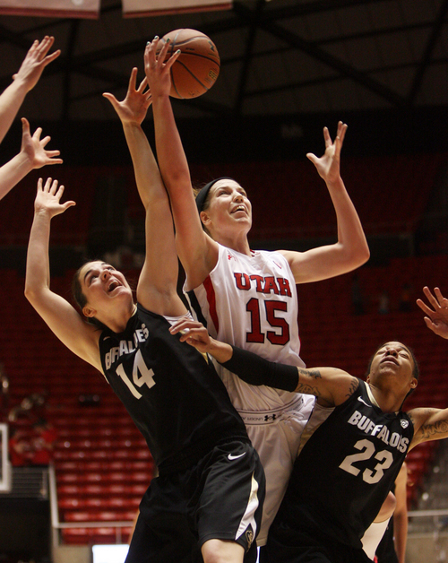 Kim Raff | The Salt Lake Tribune
University of Utah player (middle) Michelle Plouffe competes with Colorado players (left) Meagan Malcolm-Peck and Chucky Jeffery for a rebound during a game at the Huntsman Center in Salt Lake City on January 13, 2013. Utah lost the game 43-56.