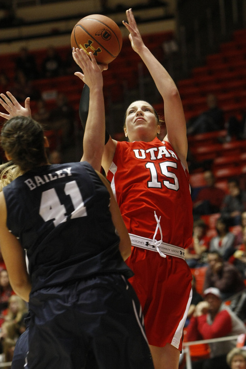Chris Detrick  |  The Salt Lake Tribune
Utah Utes forward Michelle Plouffe (15) shoots past Brigham Young Cougars forward Morgan Bailey (41) during the first half of the game at the Huntsman Center Saturday December 8, 2012. BYU is winning the game 28-21 at halftime.