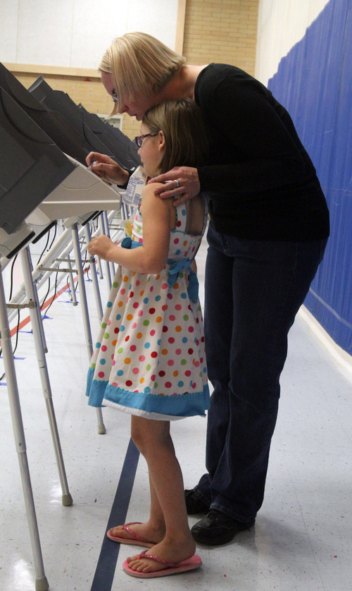 Rick Egan  |  Tribune file photo 

Six-year-old kindergarten student, Adalia Nielsen, helps her mother Melanie Nielsen vote at Pony Express Elementary School in Eagle Mountain, Tuesday, Nov. 6, 2012.