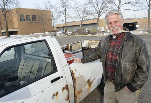 Al Hartmann  |  The Salt Lake Tribune
After four terms (16 years) Dan Snarr with his signature handlebar mustache is leaving his post as mayor of Murray.  He loads up keepsakes from his office into his ancient, rusted out Chevy S-10 truck at Murray City Hall December 31, 2013.