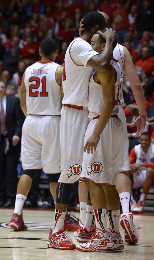 Leah Hogsten  |  The Salt Lake Tribune
Utah Utes guard Brandon Taylor (11) and Utah Utes guard/forward Dakarai Tucker (14) hug after Taylor's assist to Tucker who is fouled under the net. The University of Utah defeated Oregon State 80-69 during their game Saturday, January 4, 2014 at the Huntsman Center.