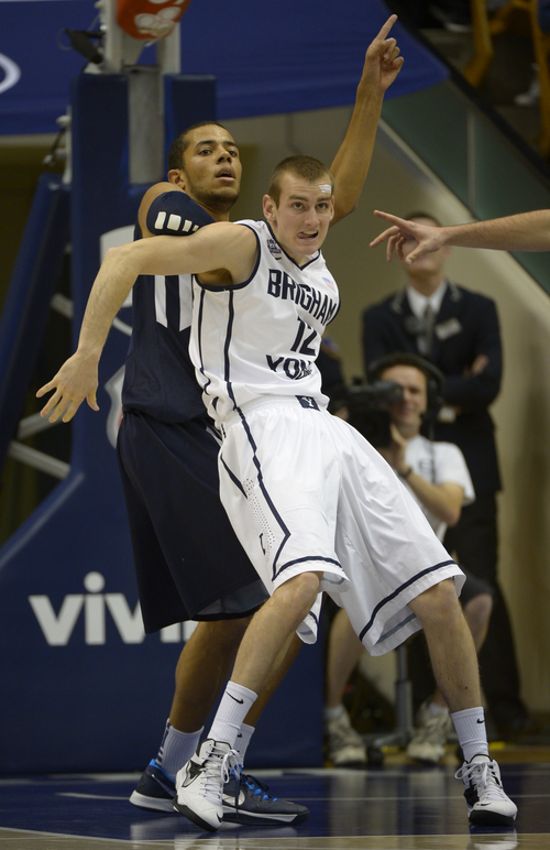 Rick Egan  | The Salt Lake Tribune 

Brigham Young Cougars forward Josh Sharp (12) tries to keep the ball from Brigham Young Cougars forward Nate Austin (33), in basketball action,  BYU vs. The San Diego Toreros at the Marriott Center,  Saturday, January 4, 2014.