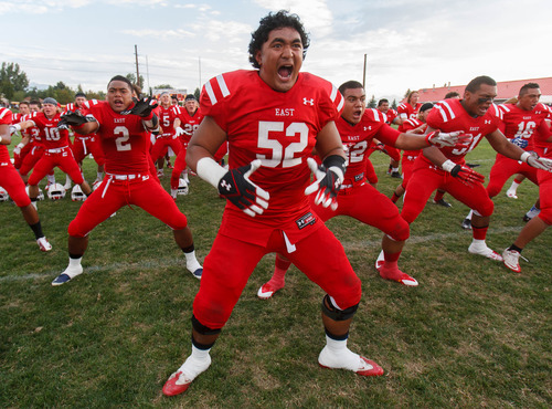 Trent Nelson  |  The Salt Lake Tribune
East players, led by Tennessee Sue'sue' perform a haka dance as East High School hosts Kahuku (HI), high school football Saturday, August 31, 2013 in Salt Lake City.