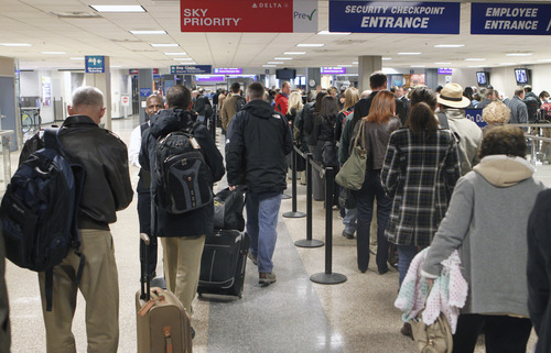 Al Hartmann  |  The Salt Lake Tribune
Fliers que up at the Salt Lake City International Airport, Terminal 2, security checkpoint Tuesday January 15 at 7:30 a.m.,  a busy time for flight departures.  At first the line looks daunting but it moves quickly with most people getting through security in about 20 minutes.