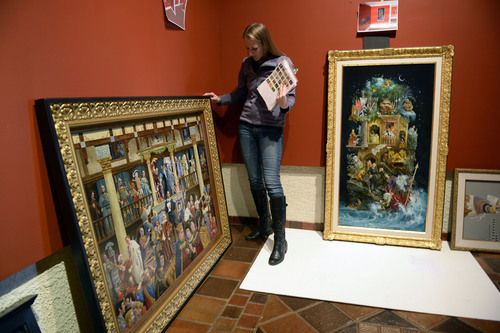 Al Hartmann  |  The Salt Lake Tribune
Julie Hall, eucation assistant at the Springville Mueum of Art, looks at art by James Christensen to be hung on December 6 for an upcoming exhibit, Curiouser and Curiouser:  The Artwork of James Christensen, Cassandra Barney, Emily McPhie and Family. The painting at left is James Christensen's "The Royal Processional."
