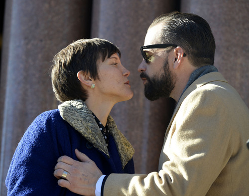 Al Hartmann  |  The Salt Lake Tribune
Newly elected city councilwoman Erin Robinson Mendenhall gets a kiss from husband Jared after taking the oath of office outside the City-County Building Monday January 6 in Salt Lake City. She was one of four councilmen that were sworn in.