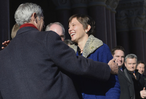 Al Hartmann  |  The Salt Lake Tribune
Newly elected city councilwoman Erin Robinson Mendenhall gets a hug from Mayor Ralph Becker after taking the oath of office outside the City-County Building Monday January 6 in Salt Lake City.
