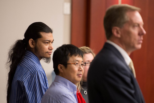 Trent Nelson  |  The Salt Lake Tribune
Esar Met, far left, stands with his defense team and translator as the jury enters at the beginning of his murder trial in Salt Lake City, Tuesday Jan. 7, 2014. Met is accused of killing 7-year-old Hser Ner Moo in 2008.