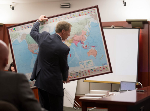 Trent Nelson  |  The Salt Lake Tribune
Defense attorney Michael Peterson brings out a world map during the defense's opening at the murder trial of Esar Met in Salt Lake City, Tuesday Jan. 7, 2014. Met is accused of killing 7-year-old Hser Ner Moo in 2008.