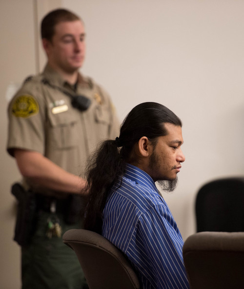 Trent Nelson  |  The Salt Lake Tribune
Esar met listens during his murder trial in Salt Lake City, Tuesday Jan. 7, 2014. Met is accused of killing 7-year-old Hser Ner Moo in 2008.