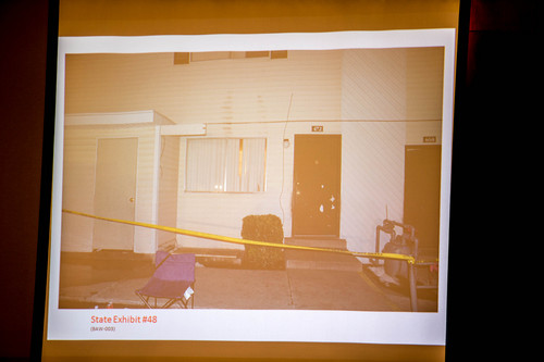 Trent Nelson  |  The Salt Lake Tribune
A photo showing the front of the apartment where Hser Ner Noo was found is displayed during the murder trial of Esar Met in Salt Lake City, Tuesday Jan. 7, 2014. Met is accused of killing 7-year-old Hser Ner Moo in 2008.