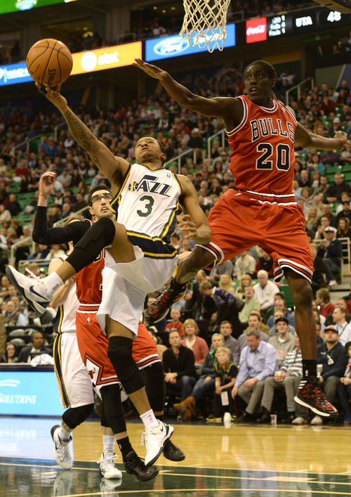 Rick Egan  | The Salt Lake Tribune 

Utah Jazz point guard Trey Burke (3) goes in for a lay up, as Chicago Bulls small forward Tony Snell (20) defends, in NBA action, as theJazz faced the Chicago Bulls, at the EnergySolutions Arena, Monday, November 25, 2013.