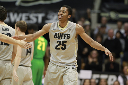 Colorado guard Spencer Dinwiddie celebrates as time runs out in the second half of Oregon in an NCAA college basketball game on Sunday, Jan. 5, 2014, in Boulder, Colo. Colorado won 100-91. (AP Photo/David Zalubowski)