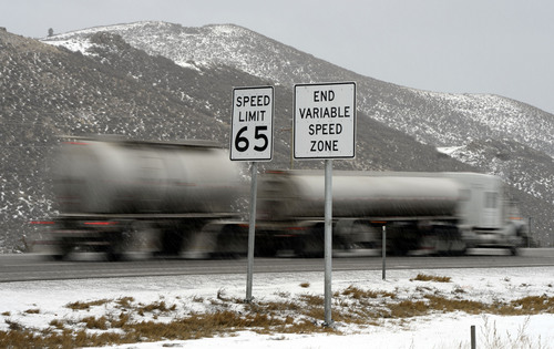 Francisco Kjolseth  |  The Salt Lake Tribune
Traffic rolls along I-80 in Parley's Canyon on Tuesday, Jan. 7, 2013, where UDOT has been switching to new electronic speed limit signs that will change the limit according to conditions.