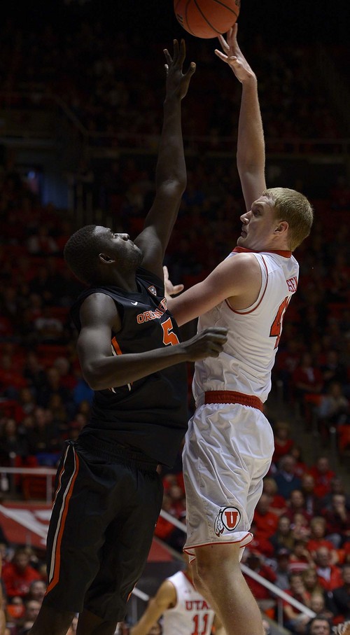 Leah Hogsten  |  The Salt Lake Tribune
Utah Utes center Jeremy Olsen (41) is fouled by Oregon State Beavers center Cheikh N'diaye (5) while driving to the net. The University of Utah defeated Oregon State 80-69 during their game Saturday, January 4, 2014 at the Huntsman Center.