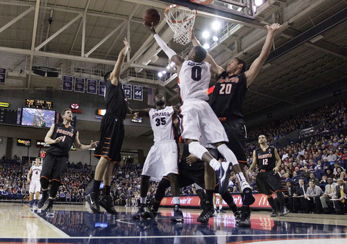 Gonzaga's Gerard Coleman (0) attempts a layup against Pacific's Ross Rivera (20) during the first half of an NCAA college basketball game on Saturday, Jan. 4, 2014, in Spokane, Wash. (AP Photo/Young Kwak)