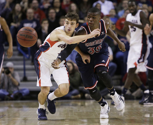 St. Mary's James Walker III (35) and Gonzaga's David Stockton fight for a loose ball during the first half of an NCAA college basketball game on Thursday, Jan. 2, 2014, in Spokane, Wash. (AP Photo/Young Kwak)