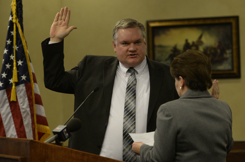 Rick Egan  | The Salt Lake Tribune 

Council member Lars Nordfelt is sworn in by city recorder Sheri McKendrick at West Valley City Hall, Monday, January 6, 2014.