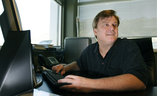 Salt Lake City-  Patrick Byrne, chief executive of Utah's Overstock.com, works in his office in Cottonwood Heights Thursday July 31, 2008.  Steve Griffin/The Salt Lake Tribune 7/31/08