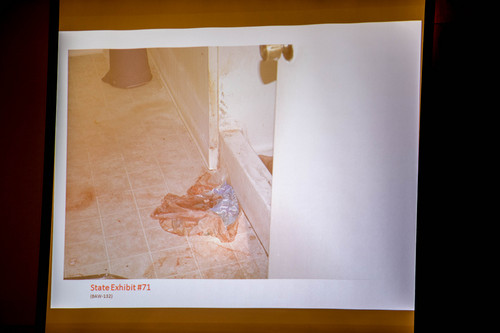 Trent Nelson  |  The Salt Lake Tribune
A photo showing blood in the basement bathroom of the apartment where Hser Ner Noo was found, displayed during the murder trial of Esar Met in Salt Lake City, Tuesday Jan. 7, 2014. Met is accused of killing 7-year-old Hser Ner Moo in 2008.