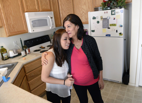 Al Hartmann  |  The Salt Lake Tribune
Lorena McKinnon, left, has never been able to bring a baby to term so her   58-year-old mother, Julia Navarro, is having the baby for her.  They are about eight months into the pregnancy.