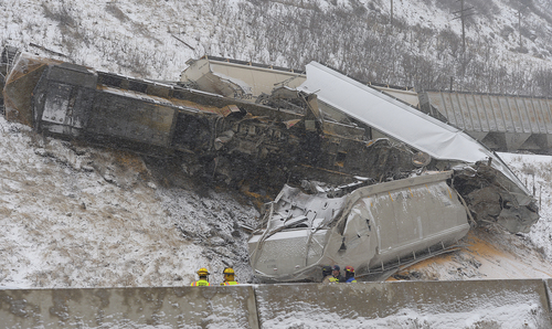 Scott Sommerdorf   |  The Salt Lake Tribune
Two freight trains collided near the mouth of Weber Canyon Wednesday, Jan. 8, 2014, sending a locomotive and eight cars loaded with grain off the tracks.