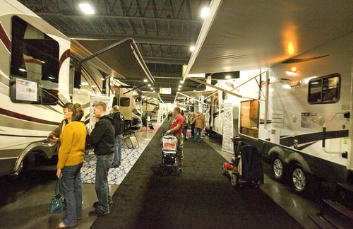Paul Fraughton  |  The Salt Lake Tribune
Visitors on Thursday stroll the long aisles of the South Towne Expo Center filled with RV's and motor homes of every category and price point. The RV show runs through Sunday.