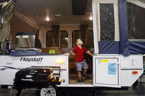 Rick Egan  | The Salt Lake Tribune 

3-year-old, KC Noyce, Riverton explores the trailers at the RV Show in Sandy, Sunday, September 18, 2011.