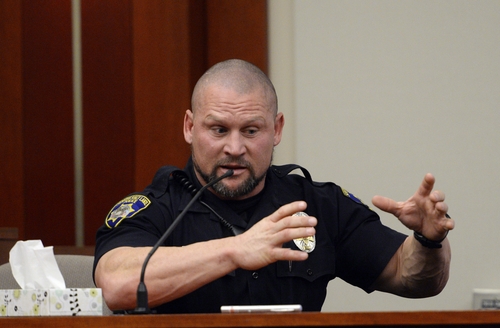 Mikal Wersland South Salt Lake Police, talks about the search for Hser Ner Moo, on the witness stand in Judge Judith Atherton's court room, at the Matheson Courthouse in Salt Lake City, Thursday, Jan. 9, 2014.  Esar Met is accused of killing 7-year-old Hser Ner Moo, who disappeared on March 31, 2008. (AP Photo/The Salt Lake Tribune, Rick Egan)