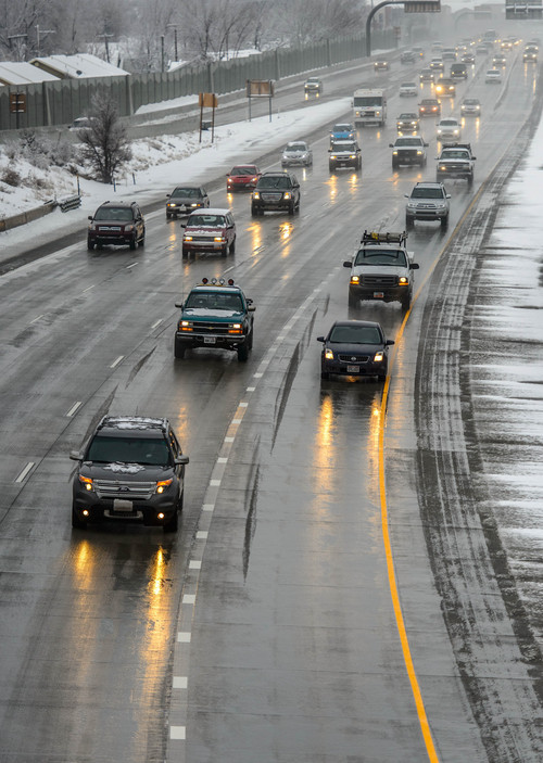 Trent Nelson  |  The Salt Lake Tribune
Traffic along I-15 during a snowy day, Thursday January 9, 2014 in Salt Lake City.